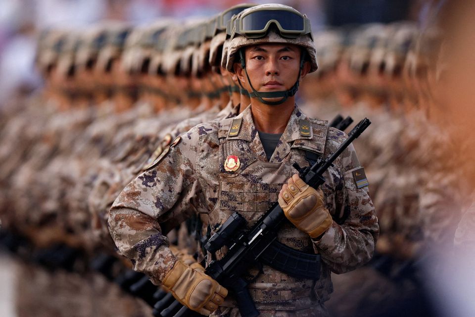 China's cyber force personnel march in Beijing, China, yesterday. Photo: Reuters